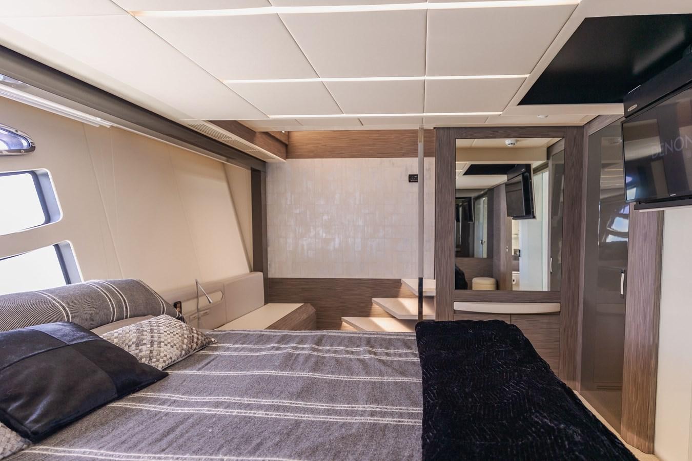 a room with a bed and a desk aboard DOUBLE OR NOTHING Yacht for Sale