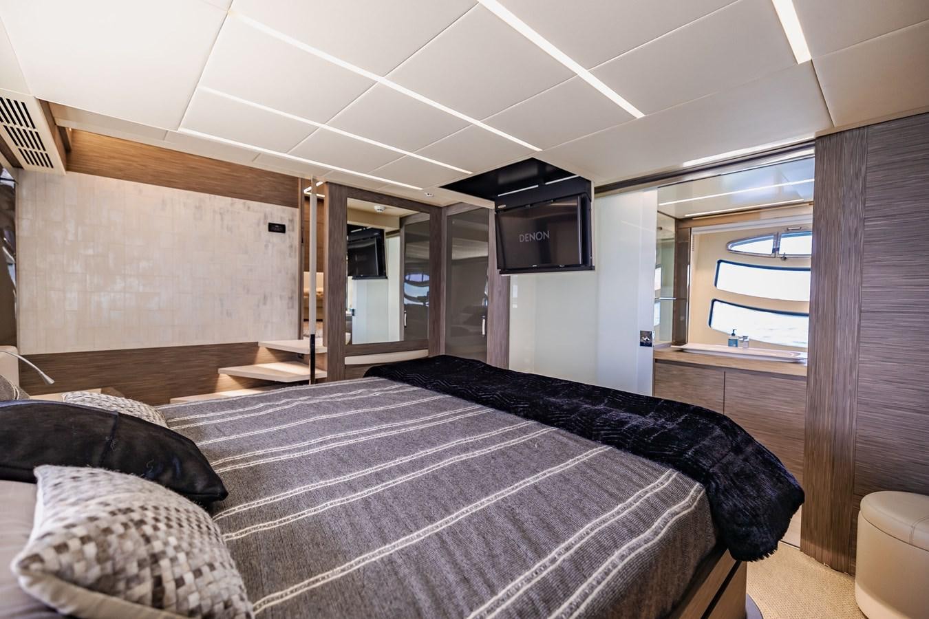 a bedroom with a bed and a tv aboard DOUBLE OR NOTHING Yacht for Sale