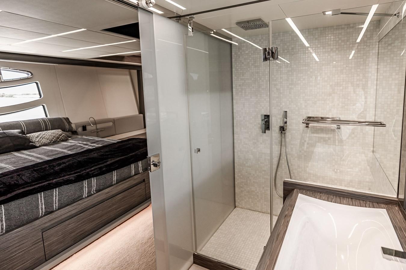 a room with a bed and a shower aboard DOUBLE OR NOTHING Yacht for Sale