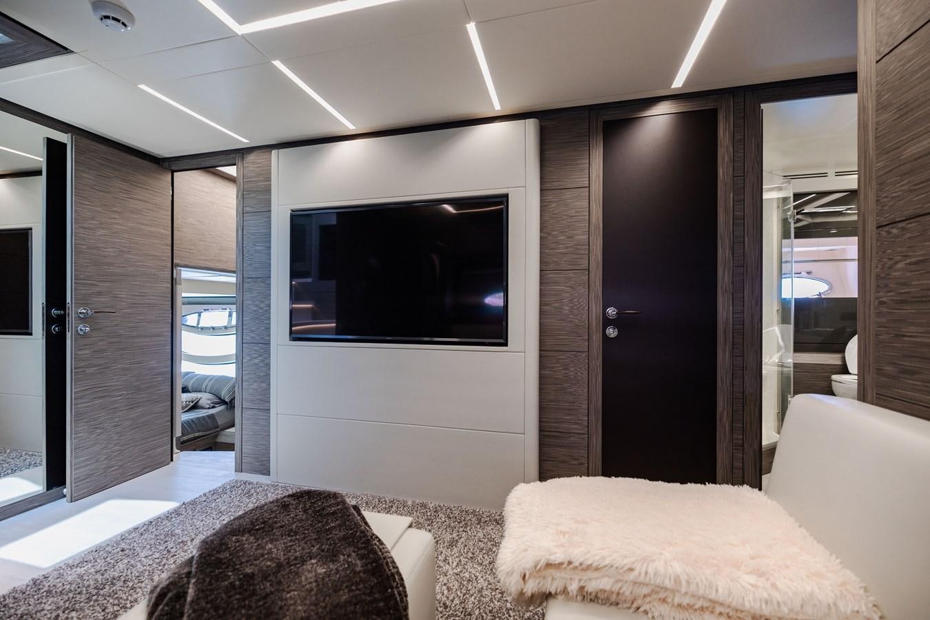 a room with a tv and a bed aboard DOUBLE OR NOTHING Yacht for Sale