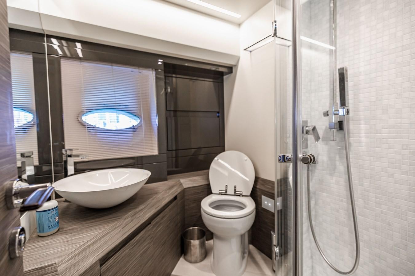 a bathroom with a large mirror aboard DOUBLE OR NOTHING Yacht for Sale