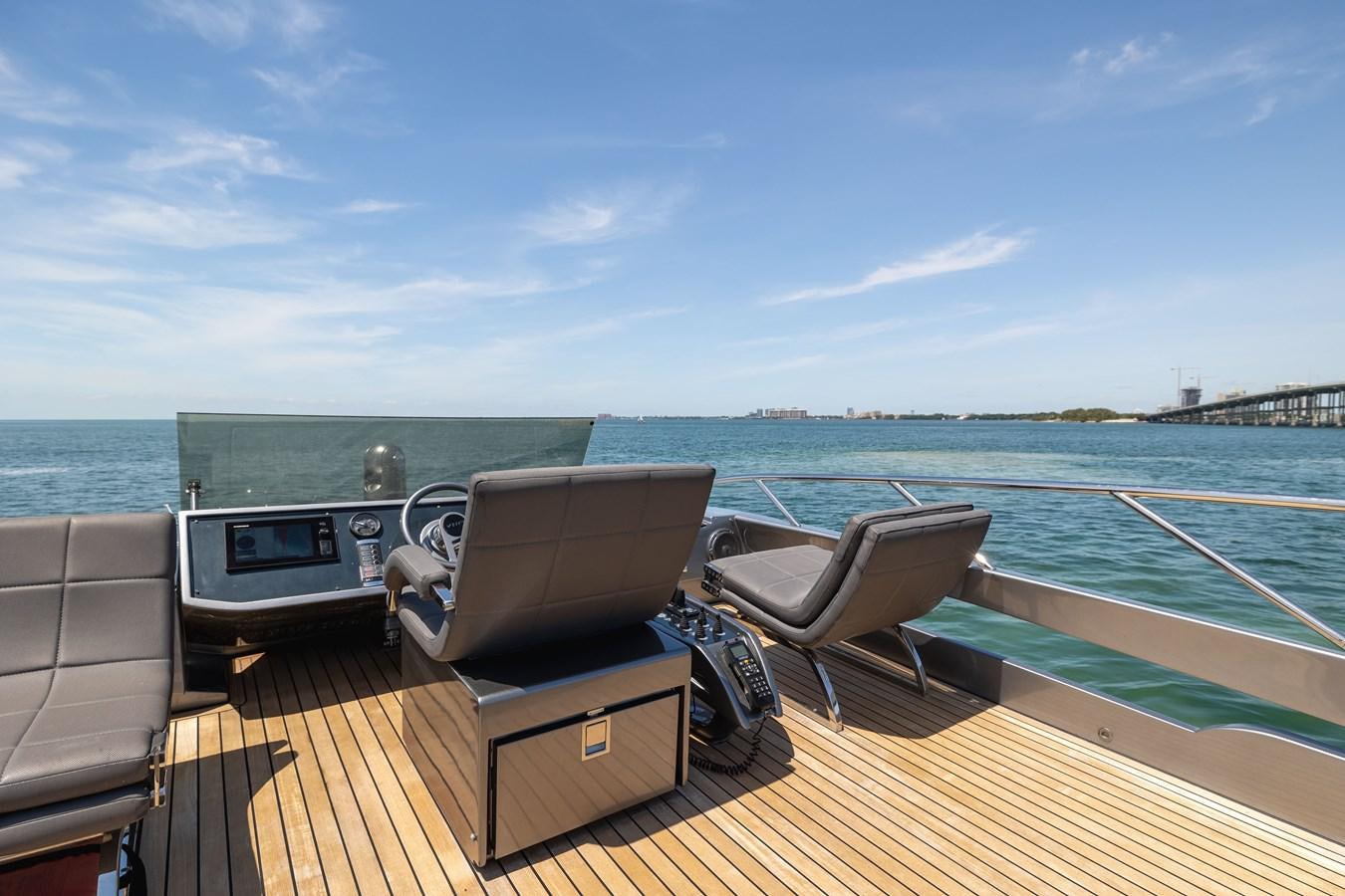 a deck with chairs and a grill on it aboard DOUBLE OR NOTHING Yacht for Sale