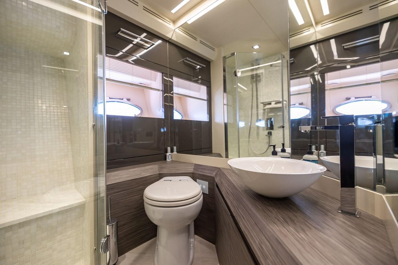 a bathroom with a large mirror aboard DOUBLE OR NOTHING Yacht for Sale