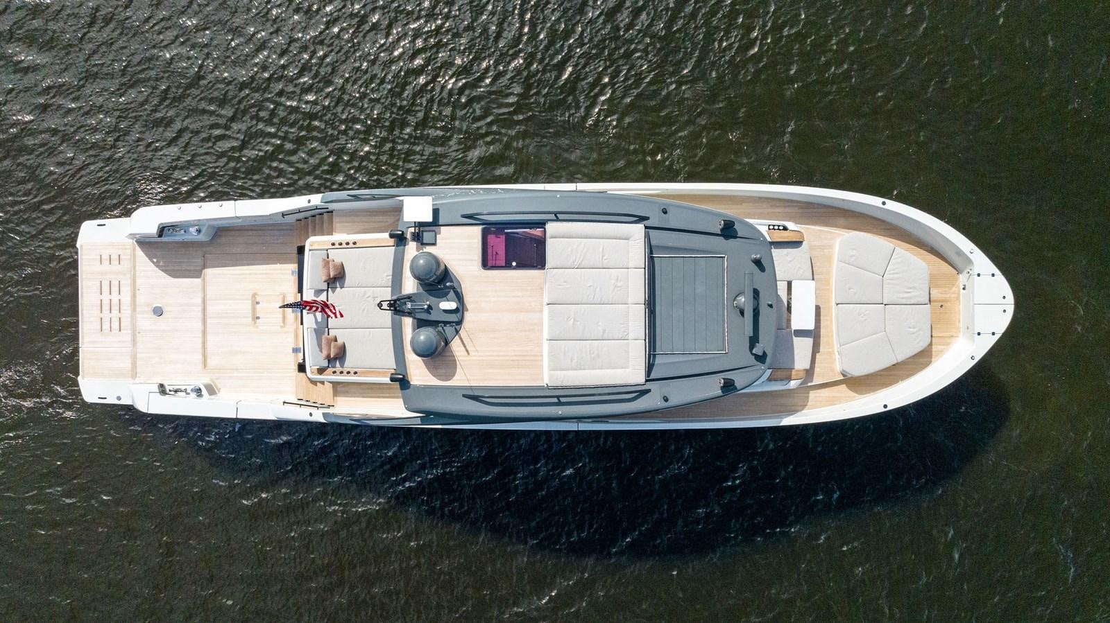 a white house with a balcony aboard SNACK MONEY Yacht for Sale