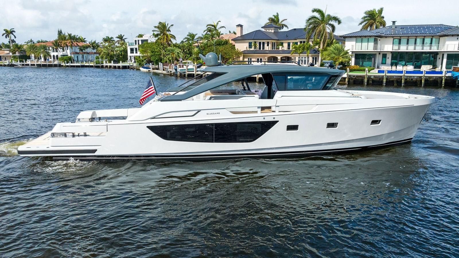 a white yacht on the water aboard SNACK MONEY Yacht for Sale