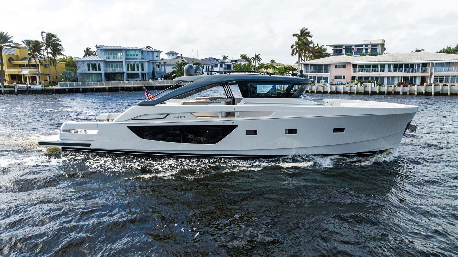 a white boat in the water aboard SNACK MONEY Yacht for Sale