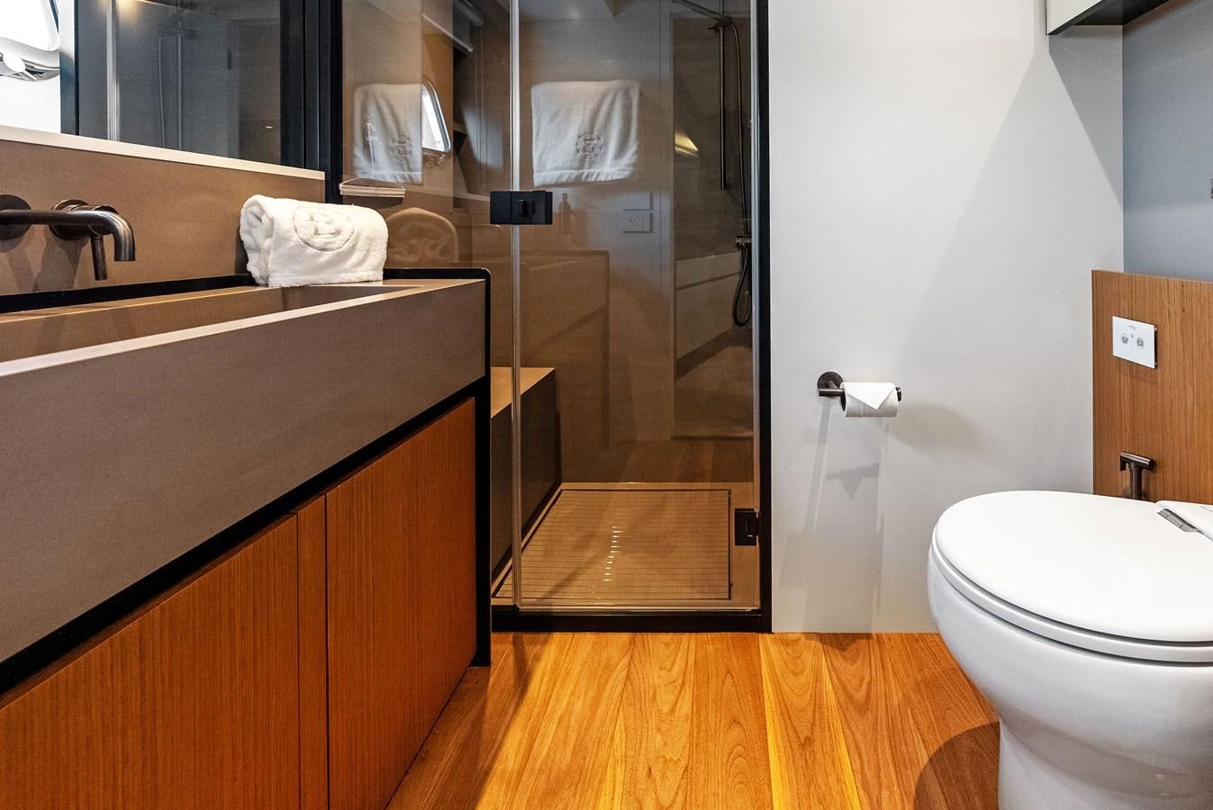 a bathroom with a glass shower aboard SNACK MONEY Yacht for Sale