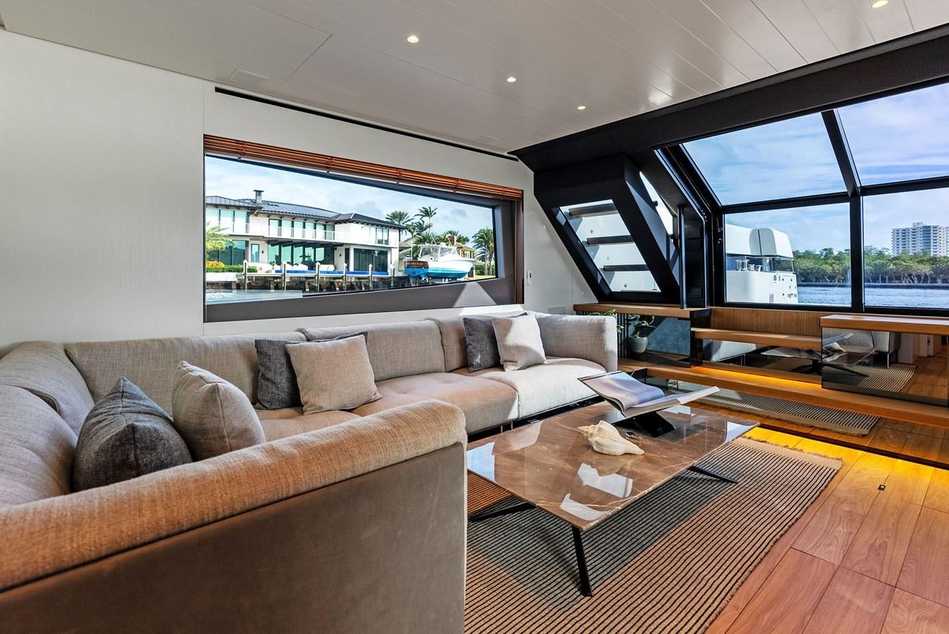 a living room with a large window aboard SNACK MONEY Yacht for Sale