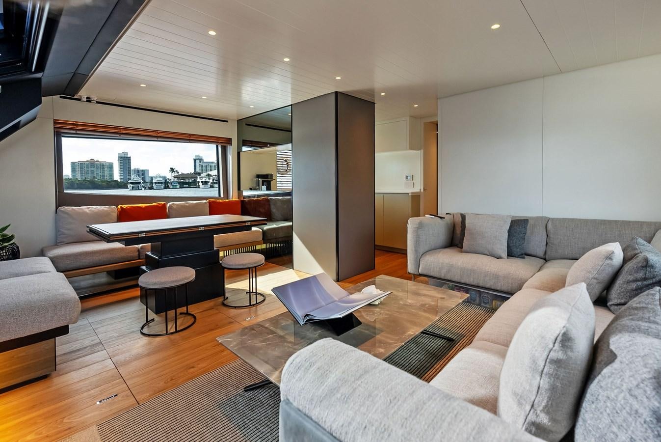a living room with a couch and a table aboard SNACK MONEY Yacht for Sale