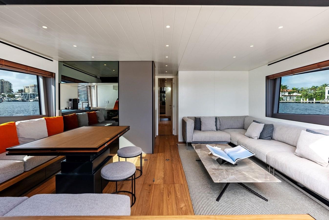 a living room with a couch and a table aboard SNACK MONEY Yacht for Sale