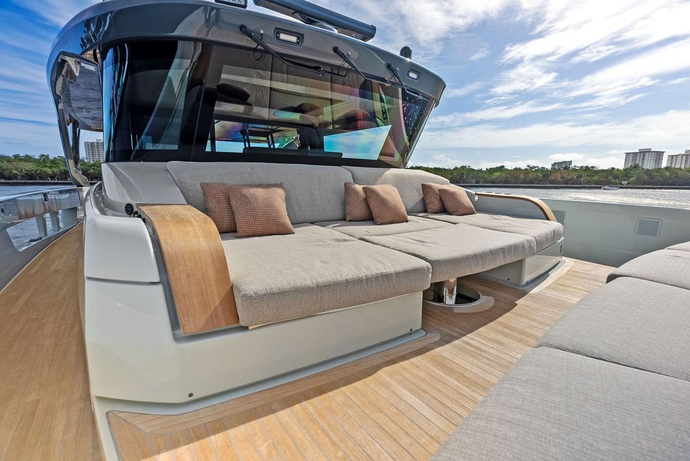 a car with a couch aboard SNACK MONEY Yacht for Sale