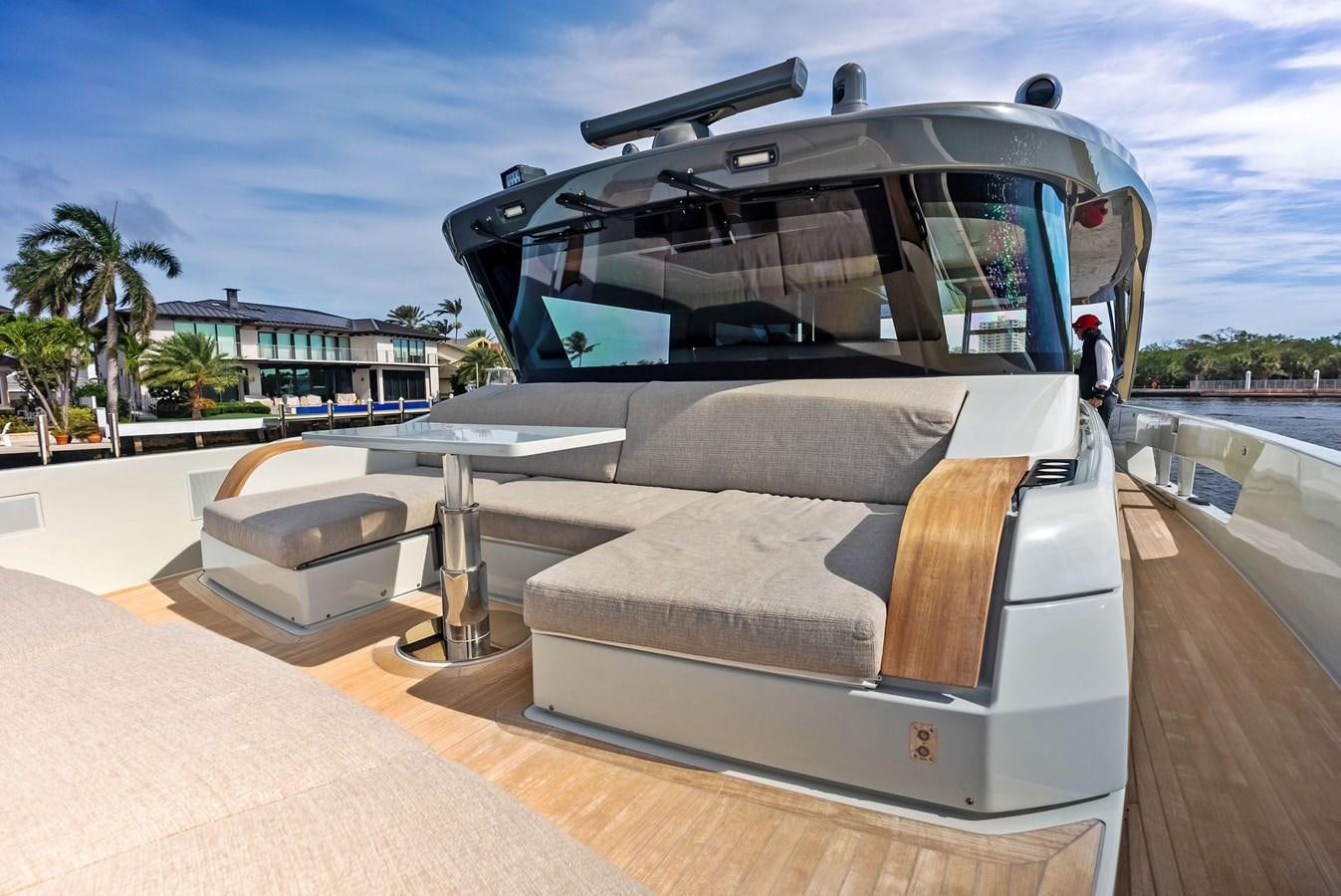a large silver vehicle with a glass top and a large white object on a deck with a person aboard SNACK MONEY Yacht for Sale