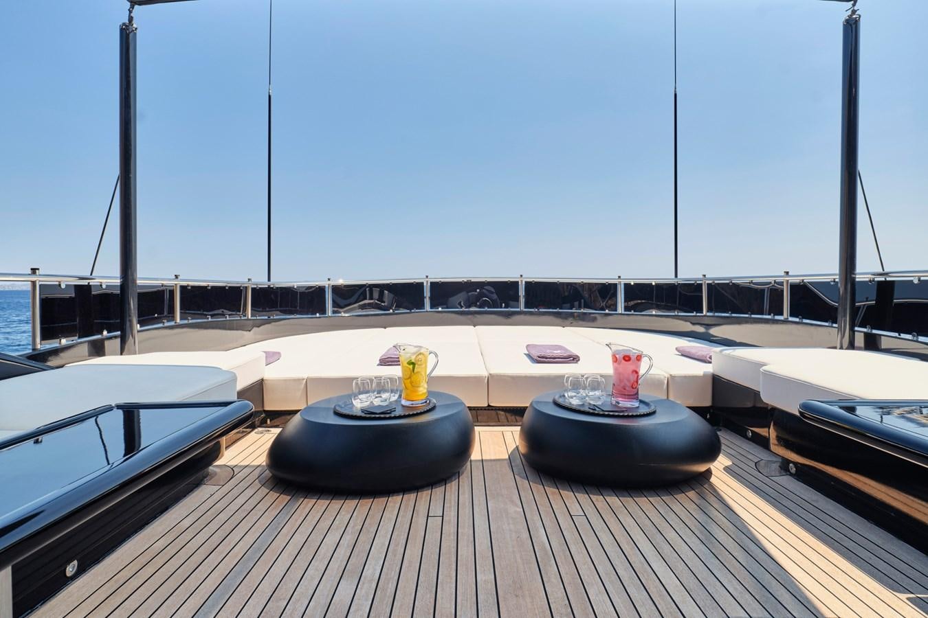 a deck with a deck and a view of the water aboard ABILITY Yacht for Sale