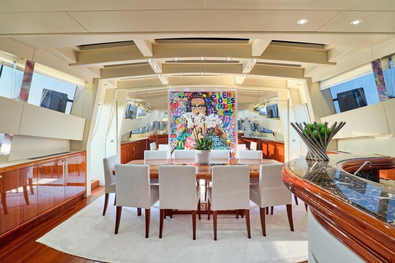 a room with tables and chairs aboard ABILITY Yacht for Sale