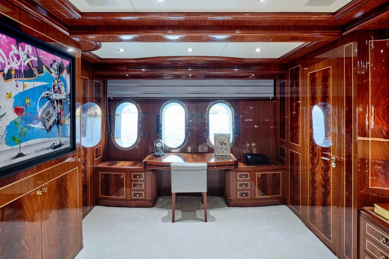 a room with a desk and a chair aboard ABILITY Yacht for Sale