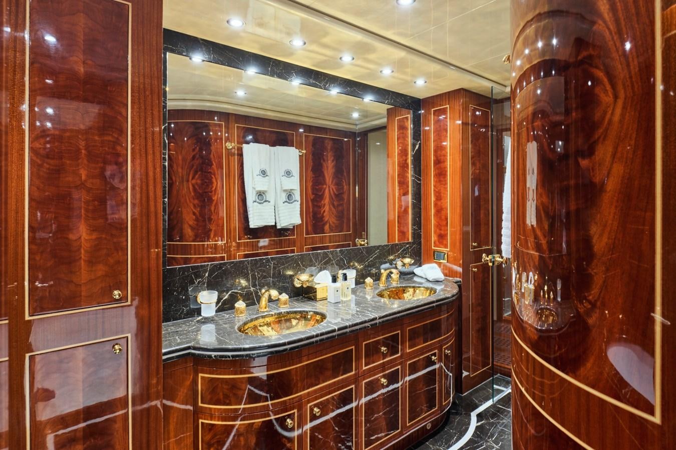 a bathroom with a countertop sink and cabinets aboard ABILITY Yacht for Sale
