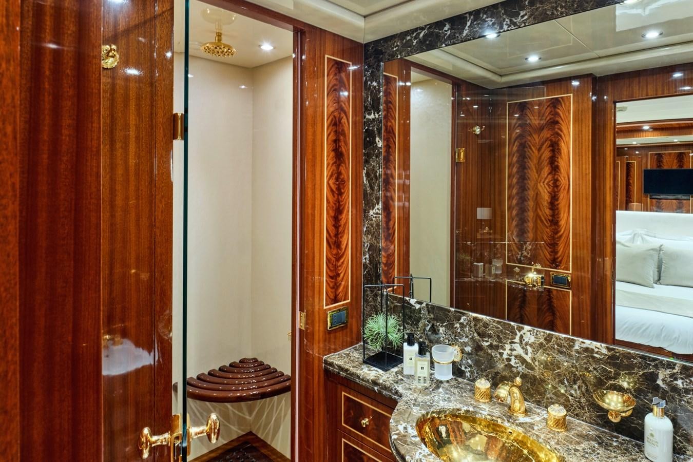 a bathroom with a large marble countertop aboard ABILITY Yacht for Sale