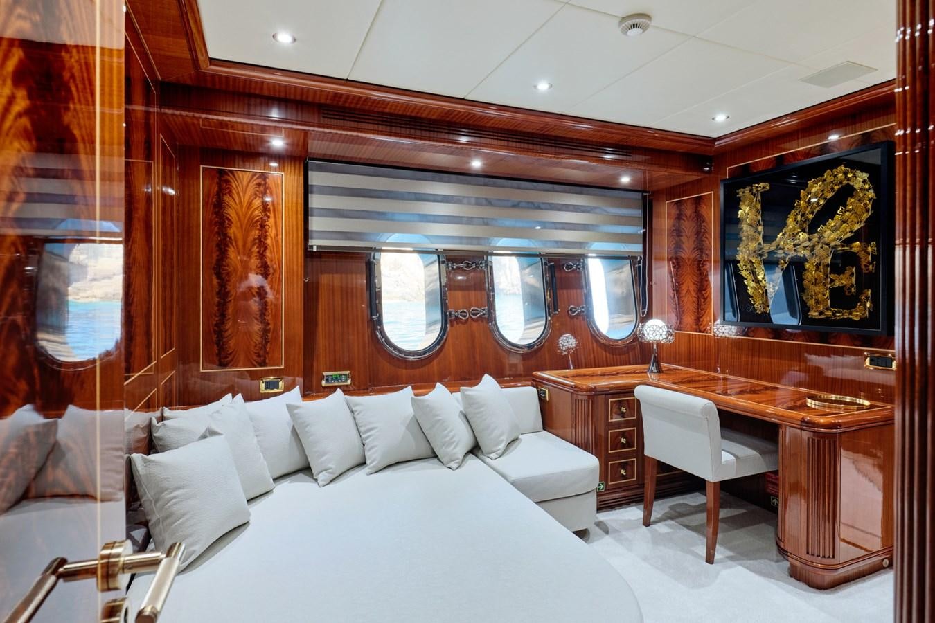 a room with a bed and a desk aboard ABILITY Yacht for Sale