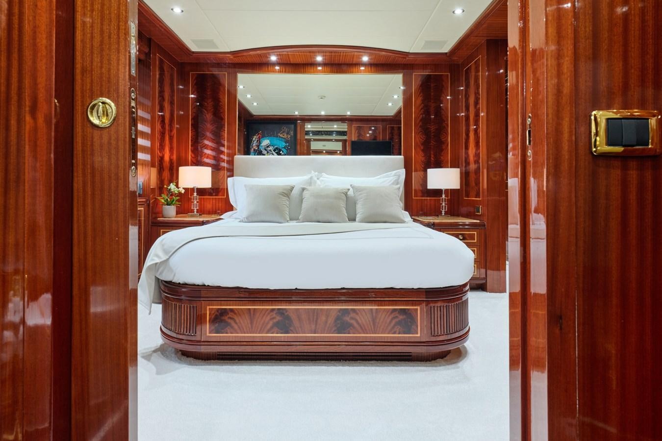 a bed in a room aboard ABILITY Yacht for Sale