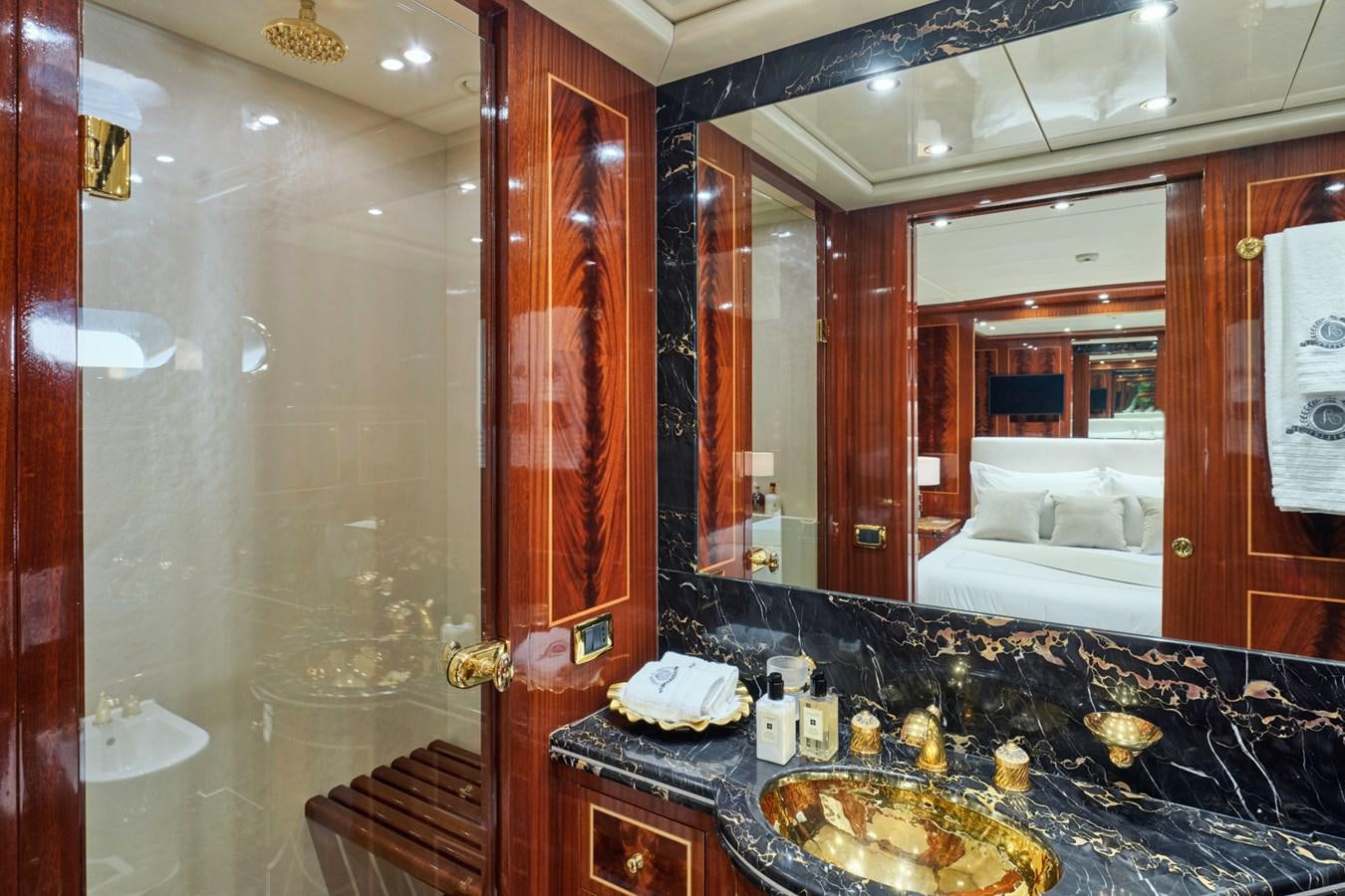 a bathroom with a large mirror aboard ABILITY Yacht for Sale