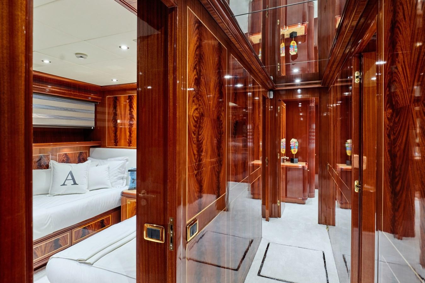 a room with a bed and a wood wall aboard ABILITY Yacht for Sale