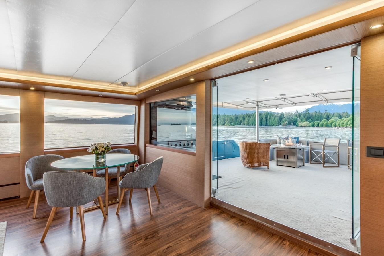 a room with a table and chairs aboard ASCENTE Yacht for Sale