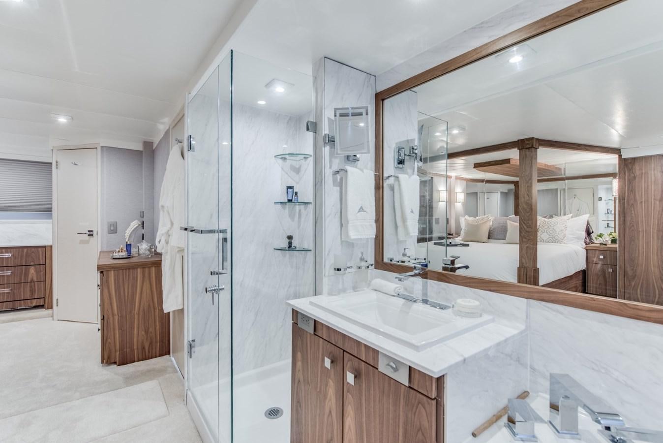 a bathroom with a large mirror aboard ASCENTE Yacht for Sale