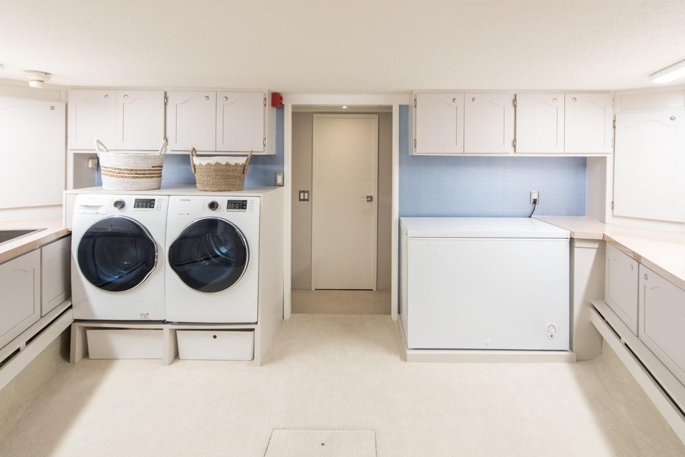 a laundry room with a washing machine aboard ASCENTE Yacht for Sale