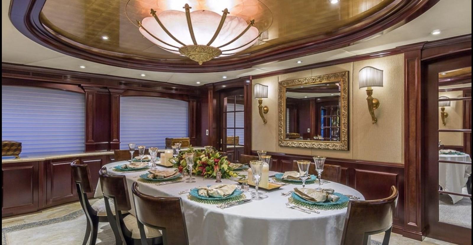 a dining room with a table set aboard TRUE LOVE Yacht for Sale