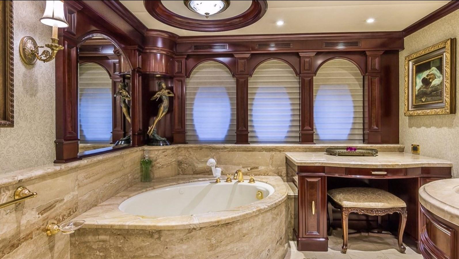 a bathroom with a large mirror aboard TRUE LOVE Yacht for Sale