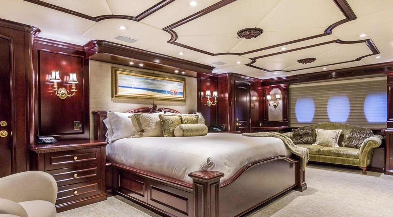 a large bedroom with a bed and a couch aboard TRUE LOVE Yacht for Sale