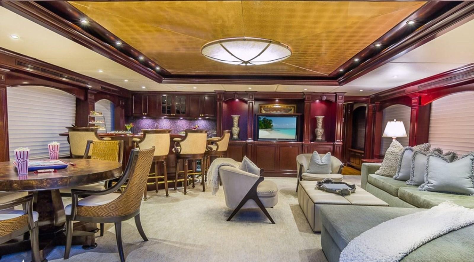 a room with a couch and a table and chairs aboard TRUE LOVE Yacht for Sale