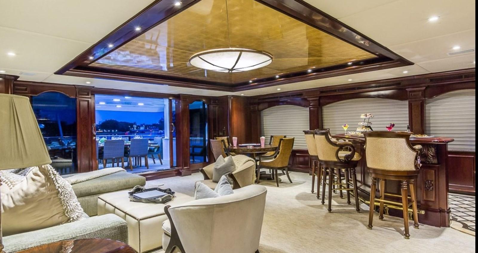 a room with a table chairs and a large window aboard TRUE LOVE Yacht for Sale