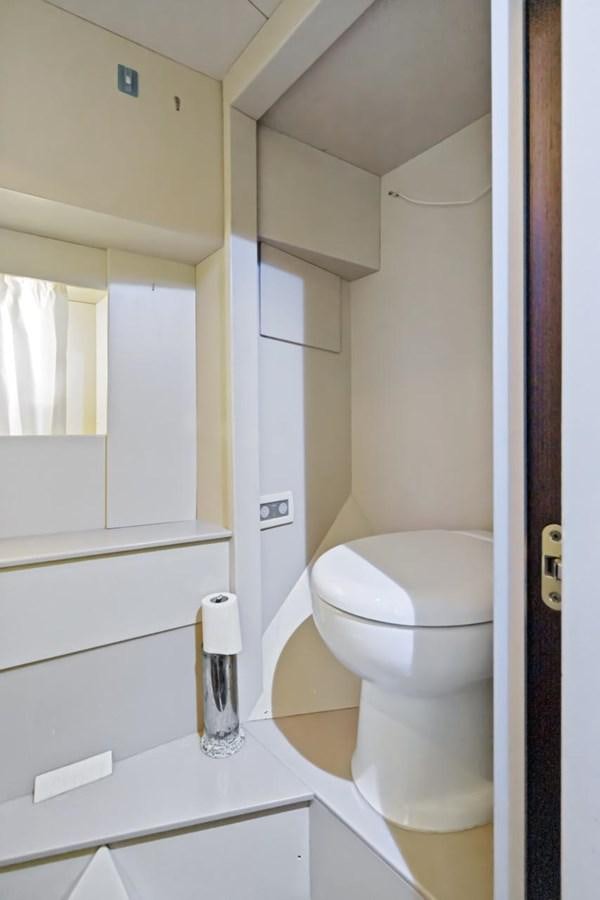 a toilet in a bathroom aboard DREAM ON Yacht for Sale