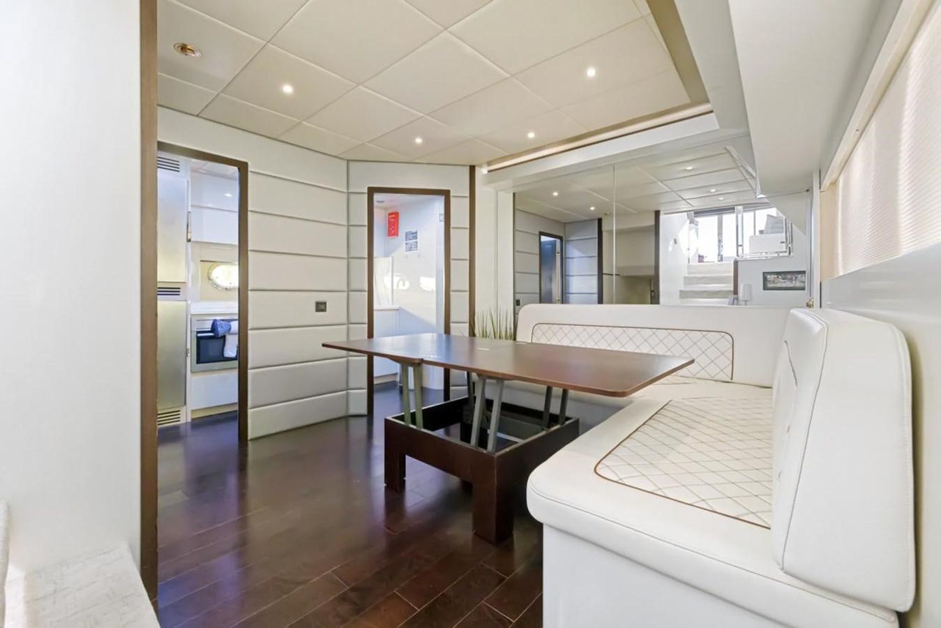 a room with a bed and desk aboard DREAM ON Yacht for Sale