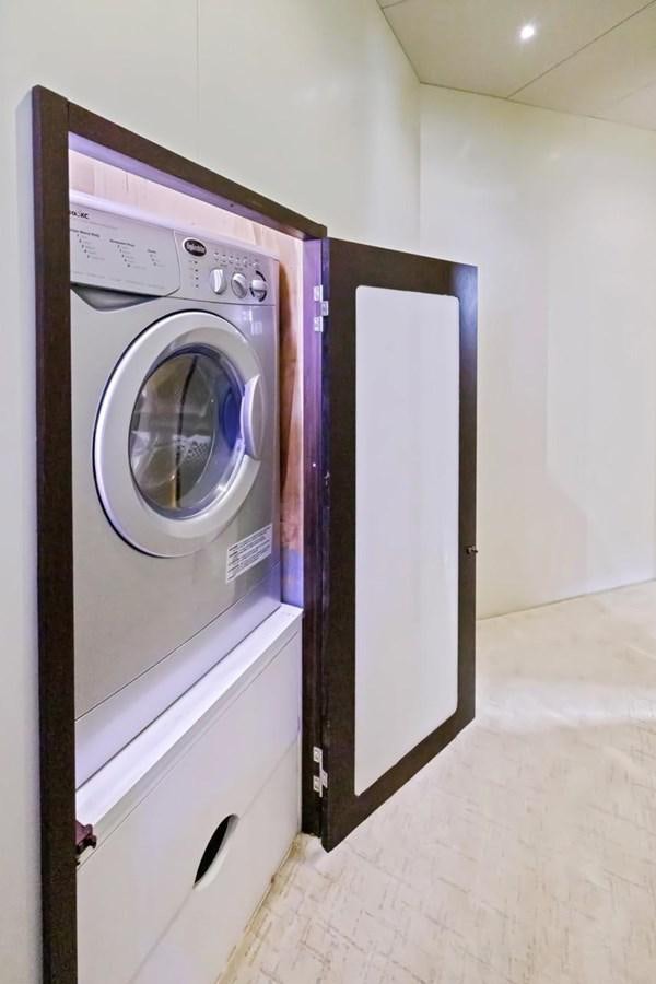 a washer and dryer in a room aboard DREAM ON Yacht for Sale