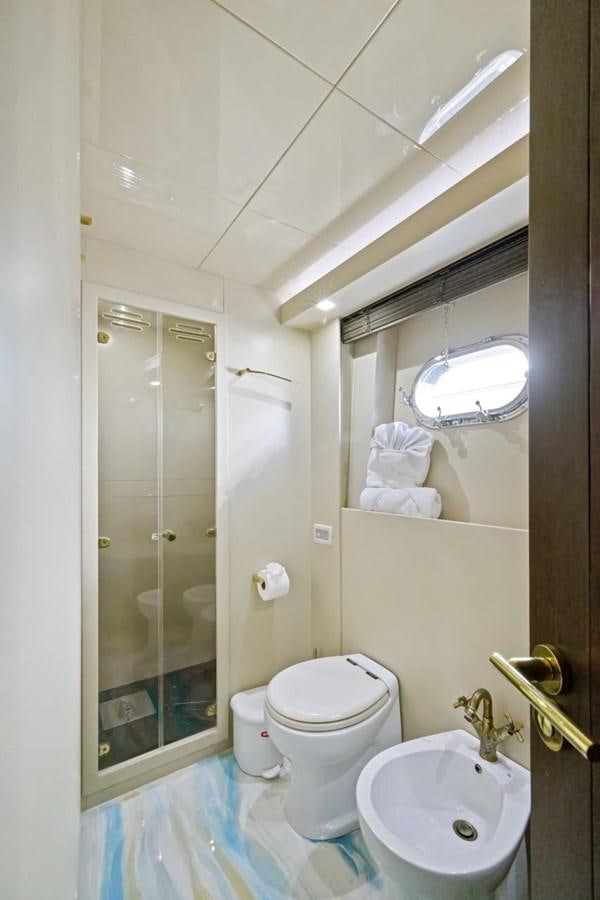 a bathroom with a glass shower aboard DREAM ON Yacht for Sale