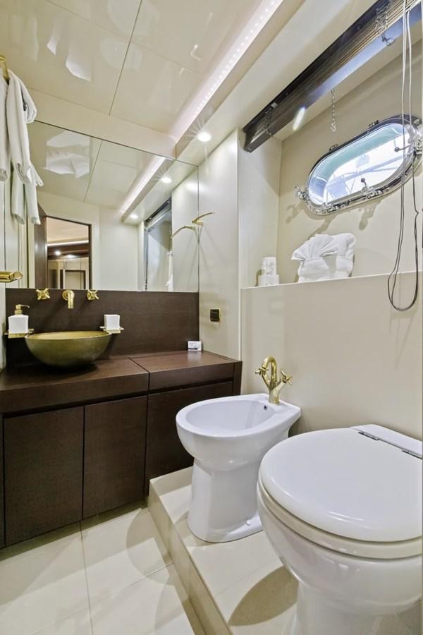a bathroom with a large mirror aboard DREAM ON Yacht for Sale