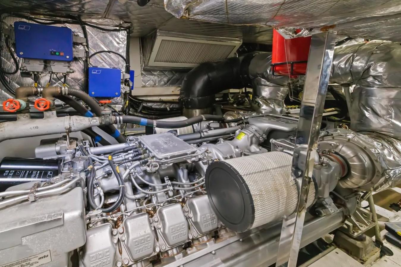 a car engine with a blue box aboard DREAM ON Yacht for Sale