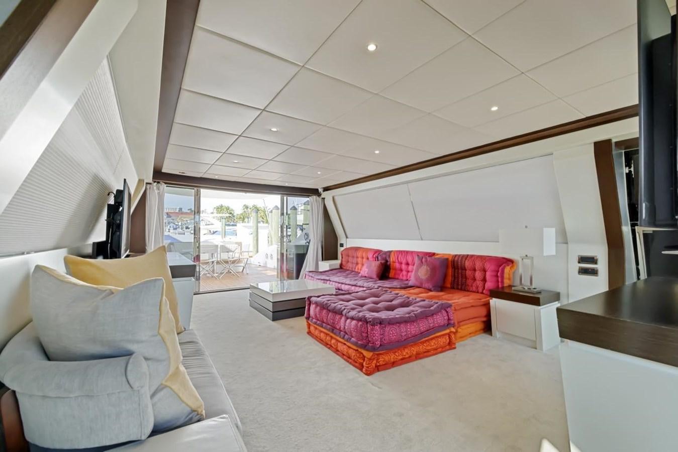 a living room with a couch and a table aboard DREAM ON Yacht for Sale