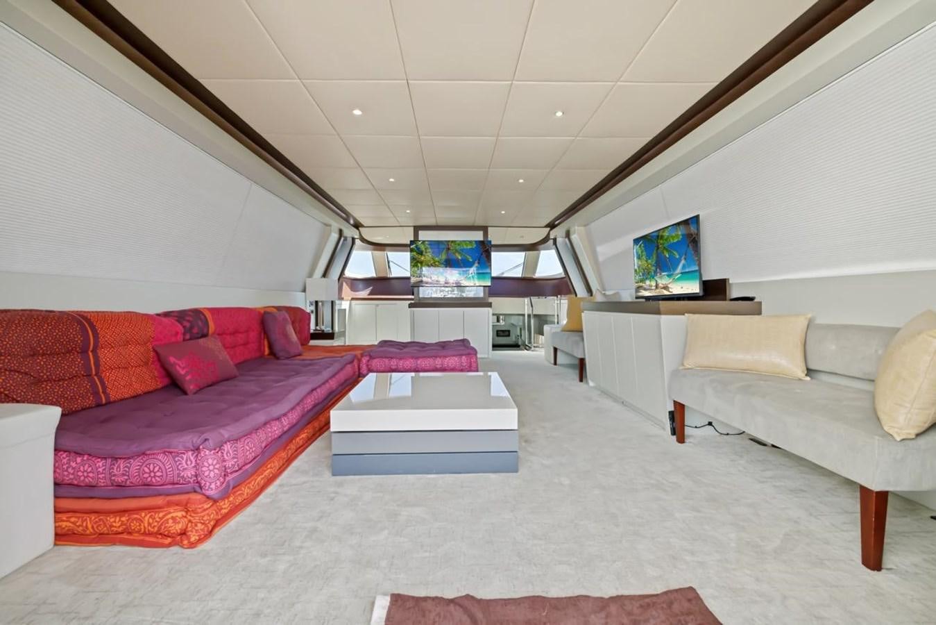 a living room with a couch and a tv aboard DREAM ON Yacht for Sale