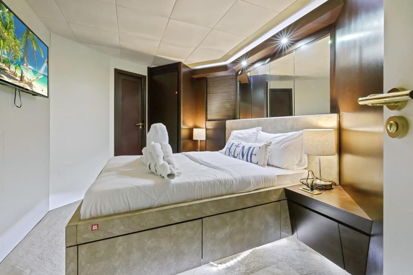 a bed with white sheets aboard DREAM ON Yacht for Sale