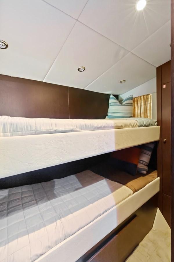 a bed with a white sheet aboard DREAM ON Yacht for Sale