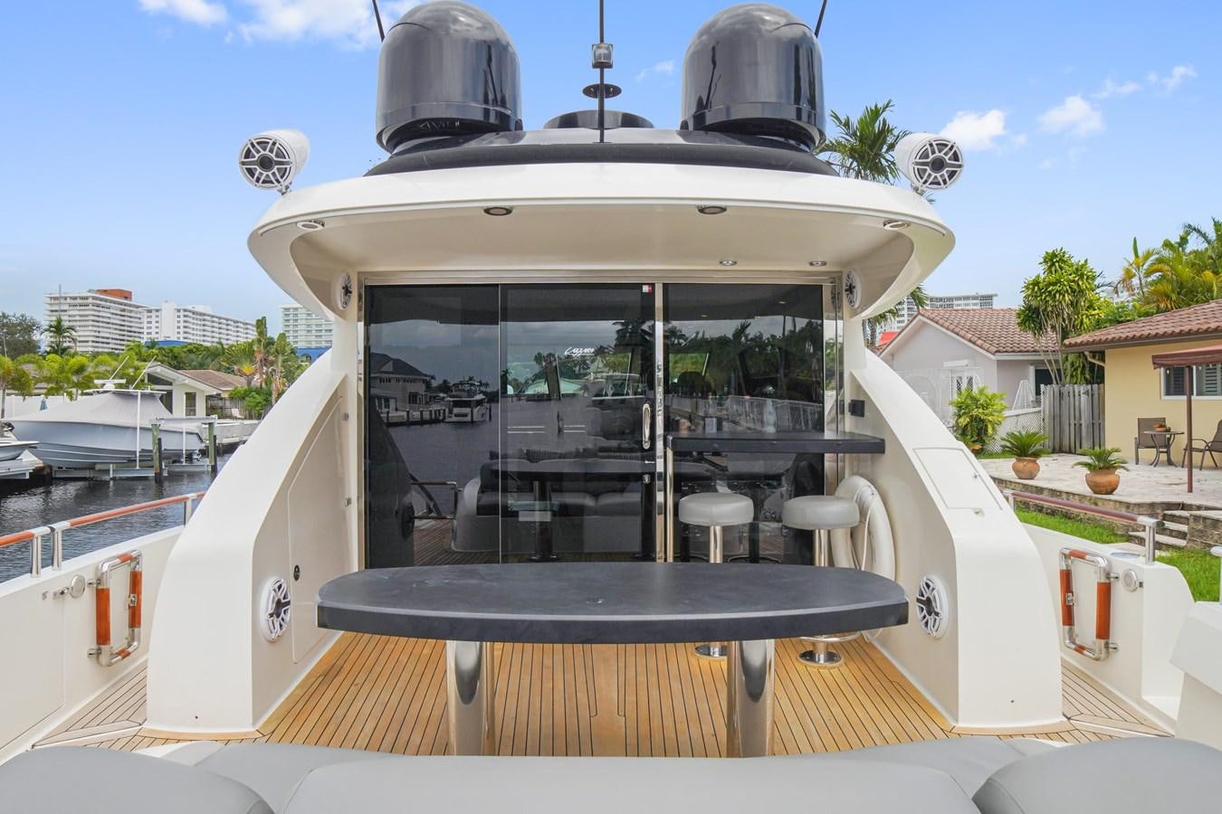 a boat with a large satellite dish on top aboard LAZZARA 68' Yacht for Sale