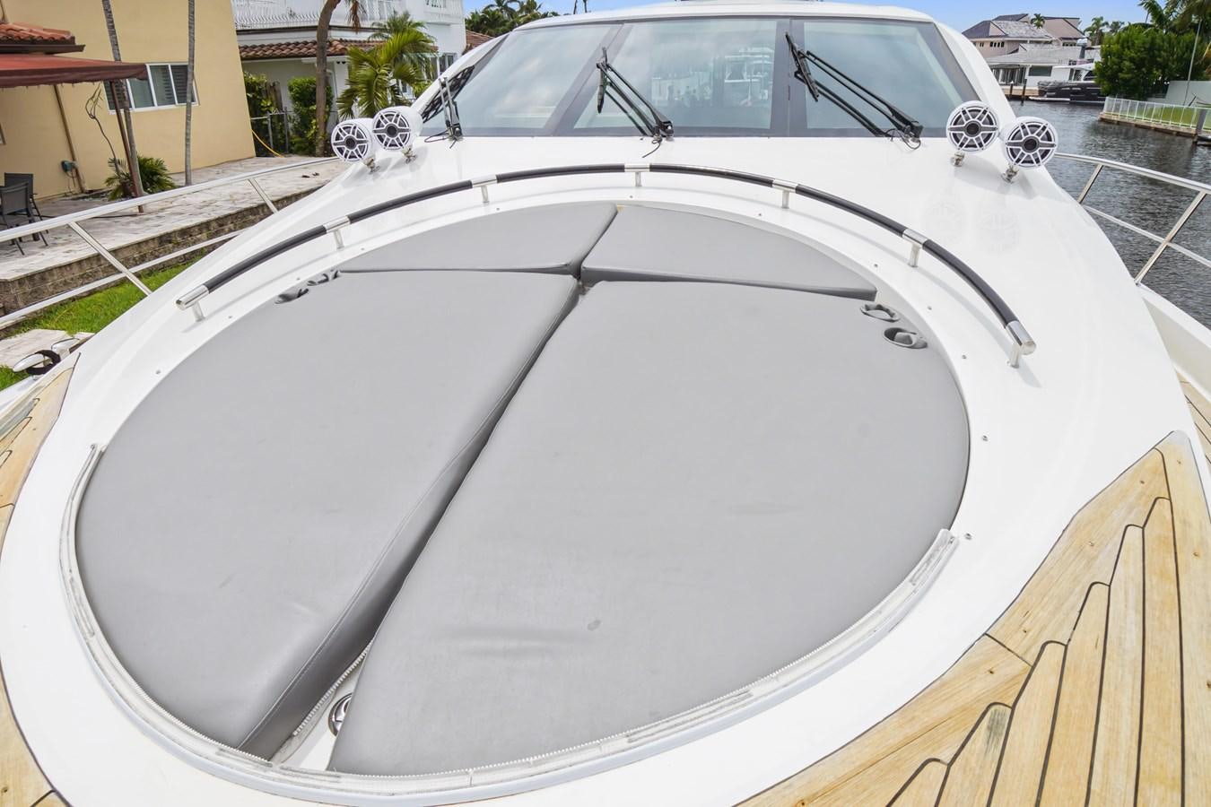 a white car with a large white hood aboard LAZZARA 68' Yacht for Sale