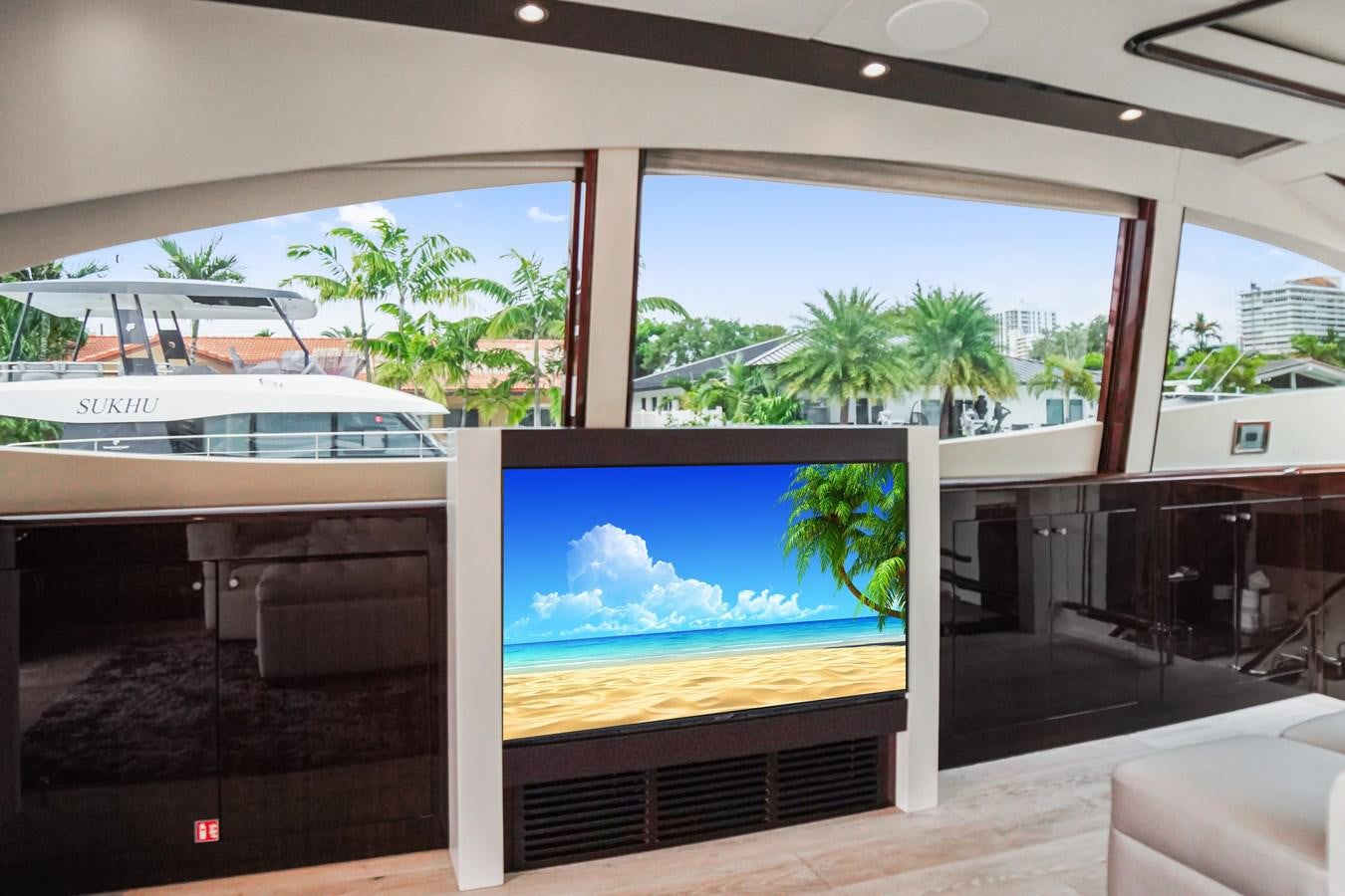 a tv on a table aboard LAZZARA 68' Yacht for Sale