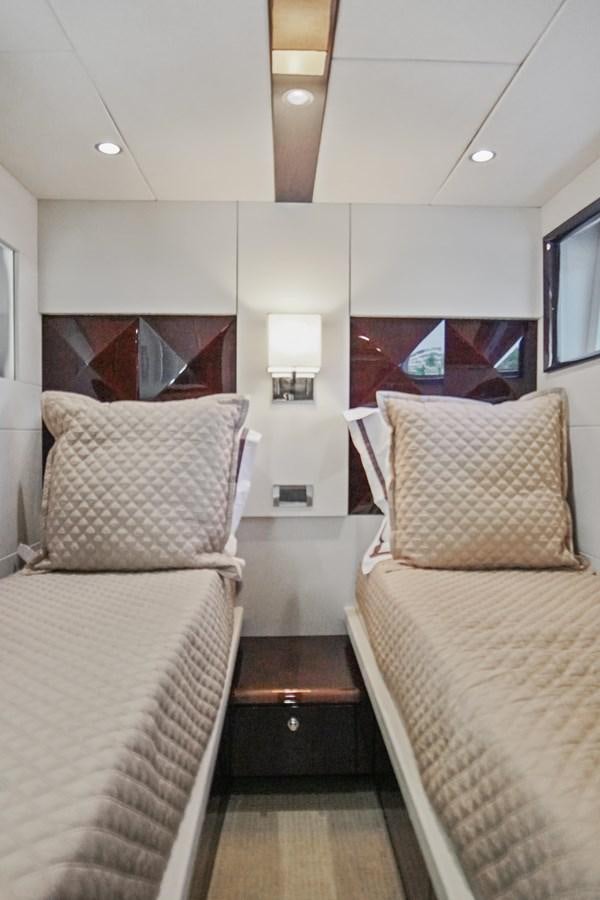 a couple of beds in a room aboard LAZZARA 68' Yacht for Sale