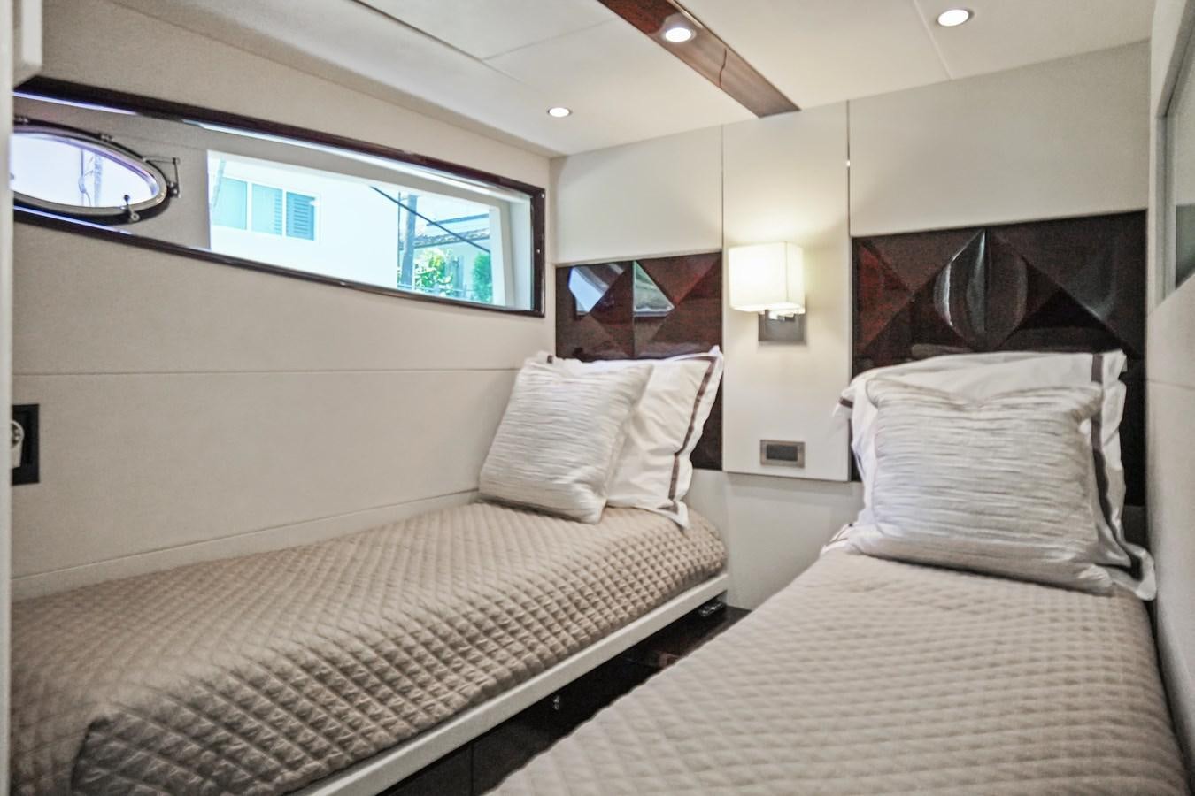 a couple of beds in a room aboard LAZZARA 68' Yacht for Sale