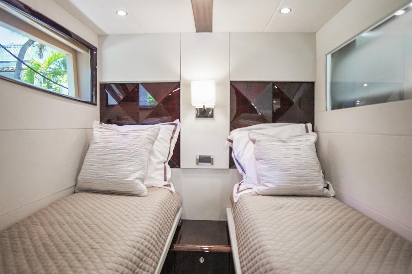 a couple of beds in a room aboard LAZZARA 68' Yacht for Sale
