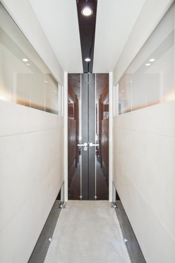 a hallway with doors aboard LAZZARA 68' Yacht for Sale